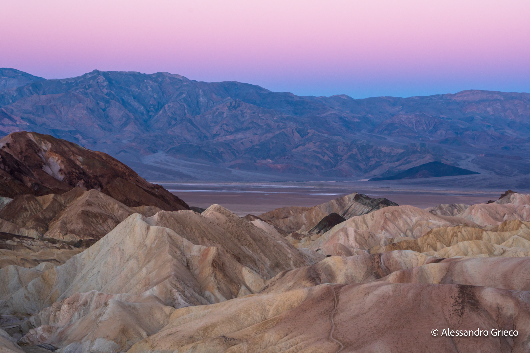 Zabriskie Point, the badlands catching the last pink light before the salt flats