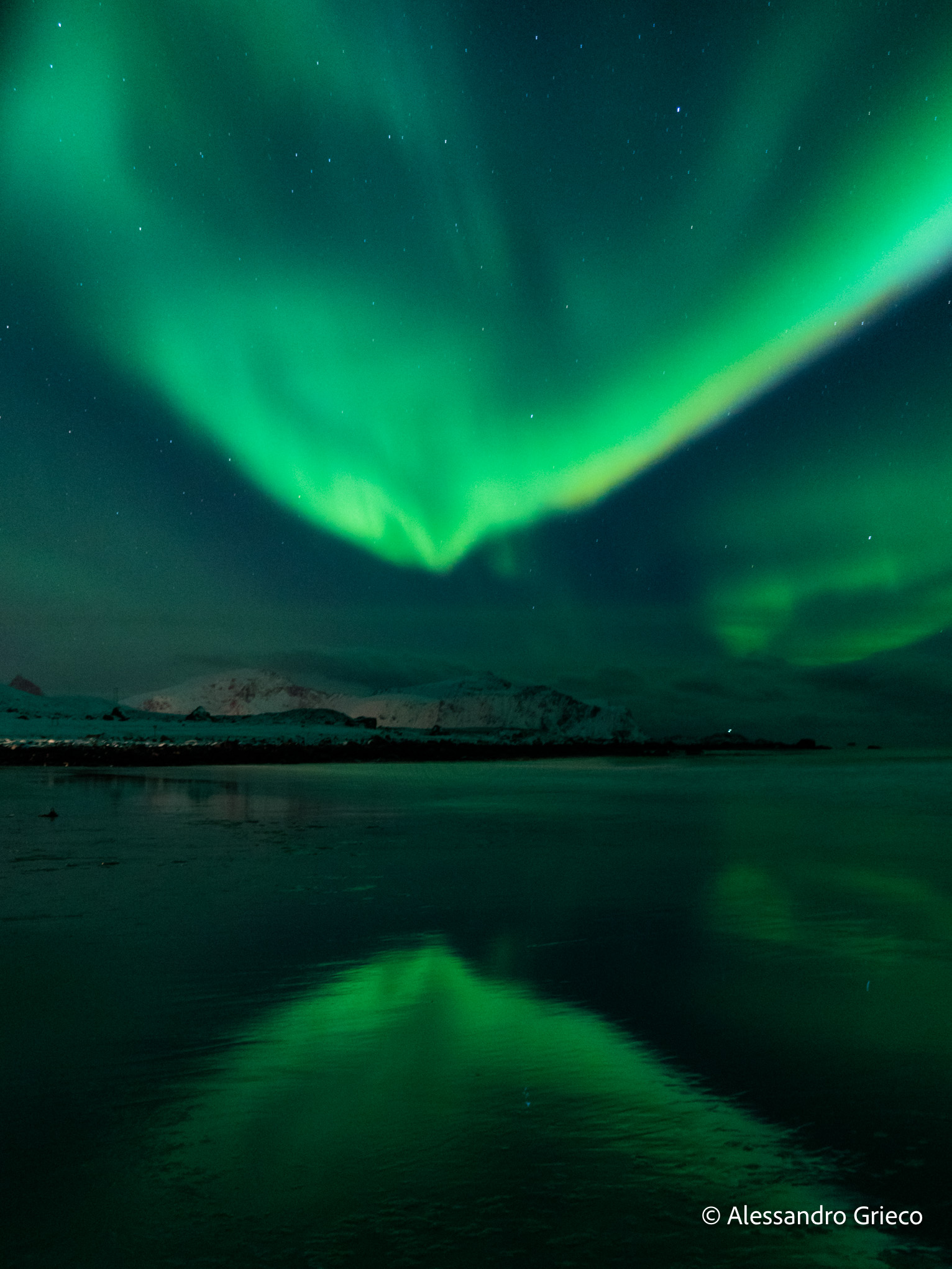 Skagsanden beach · the northern lights, doubled in the still water