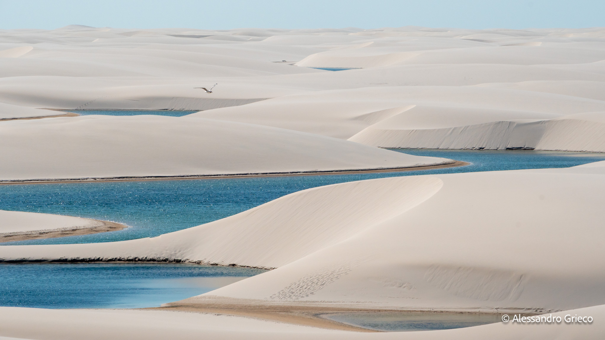 Pools within pools, dunes layered toward the horizon